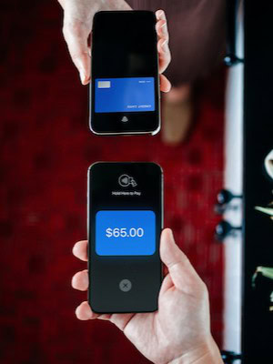 Mobile payment transaction with smartphone and contactless payment device.