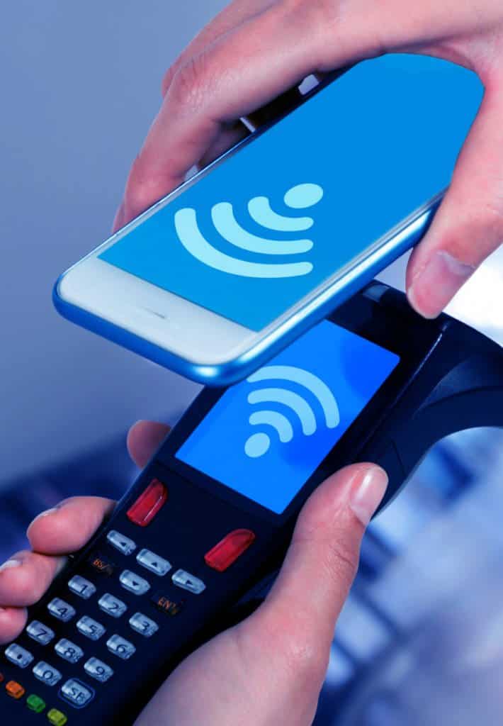 A person uses their smartphone to pay
