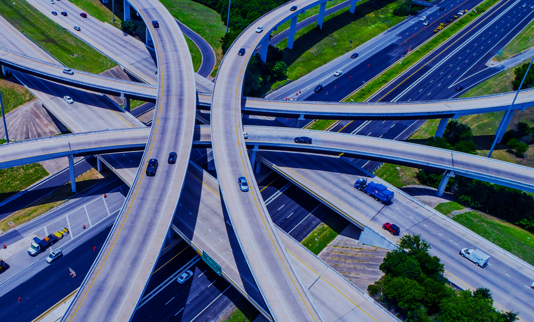 A highway overpass as seen from above. 