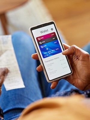Mobile payment app on smartphone displaying digital wallet and transaction history.