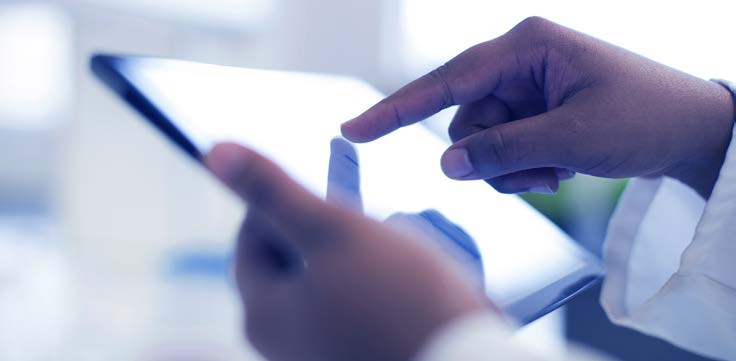 Business Person typing on a tablet