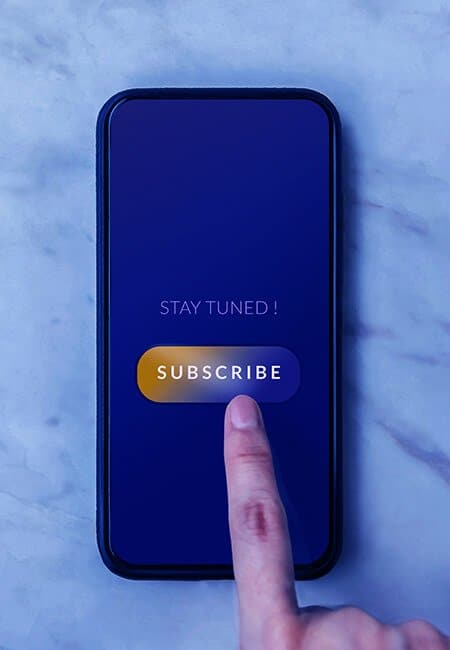 A closeup of a smartphone as someone subscribes to a service.