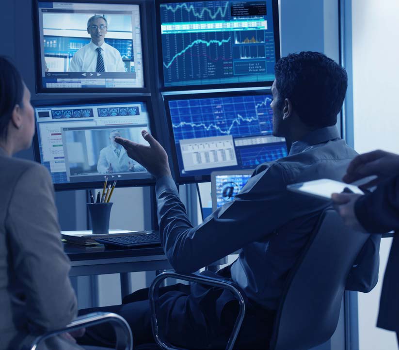 man on conference call with analytics and dashboards