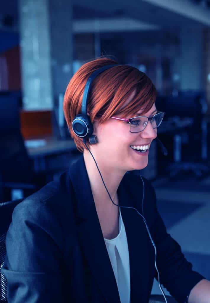 Woman with a headset on smiling