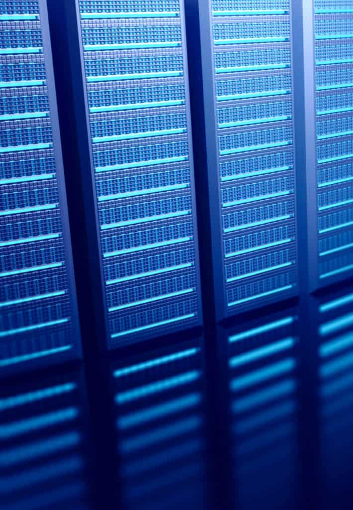 A generic wall of servers, there is a distinct blue glow to the image. 