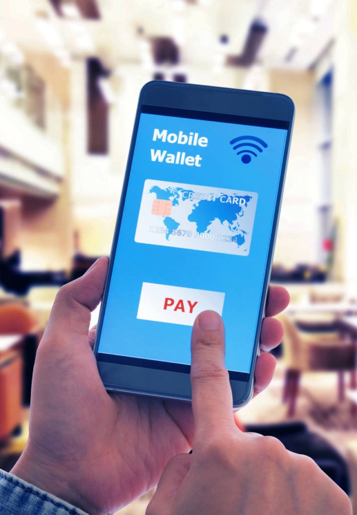 A person pays for a purchase using their phone's mobile wallet.