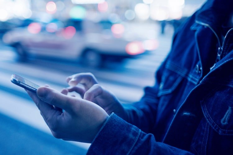 Man on cellphone making payment