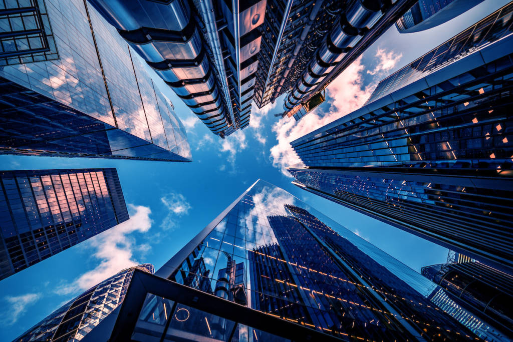 Looking directly up at the skyline of the financial district in central London - stock image