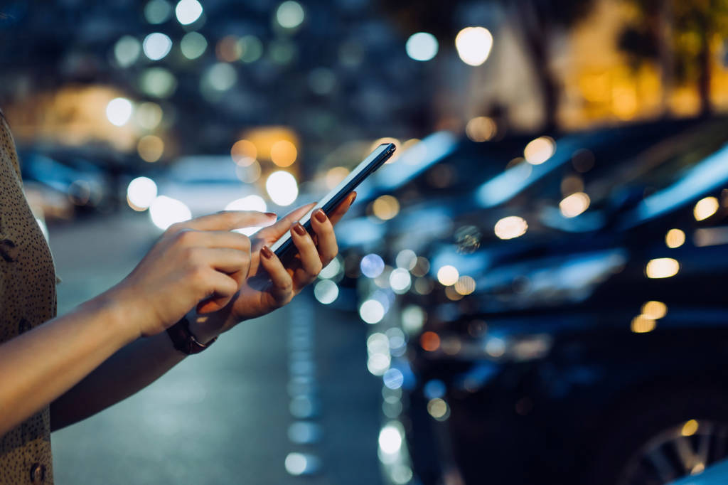 Cropped shot of a woman's hand using smartphone for shopping